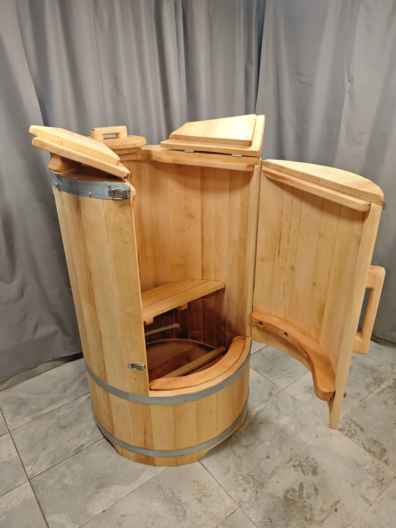 Open Miera Norm-1 steam barrel sauna with the seat visible